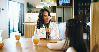 Buy stock photo Cards, home or education with mother and daughter in dining room together. Growth, homework or learning with girl child and parent woman in apartment for school sounds for language development