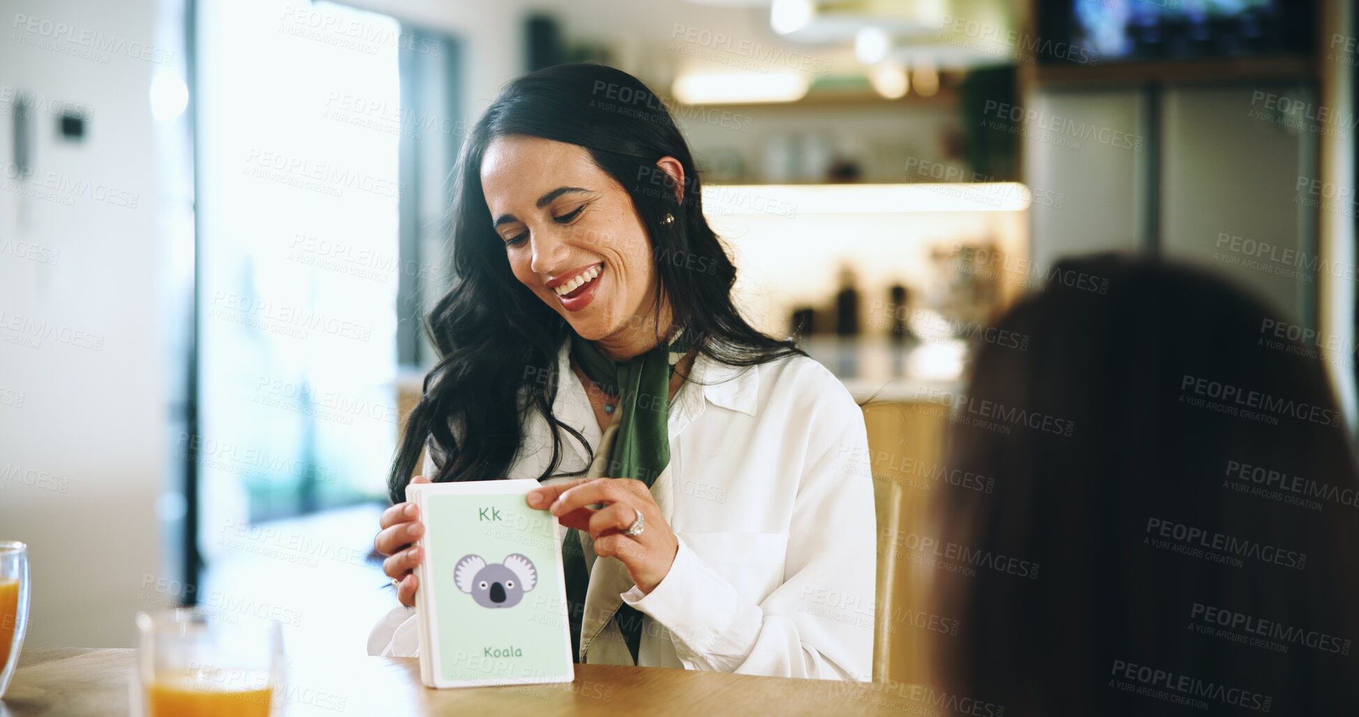Buy stock photo Cards, education and smile of mom with daughter in dining room of home together. Growth, language or learning sounds with girl child and happy single parent woman in apartment for school assignment
