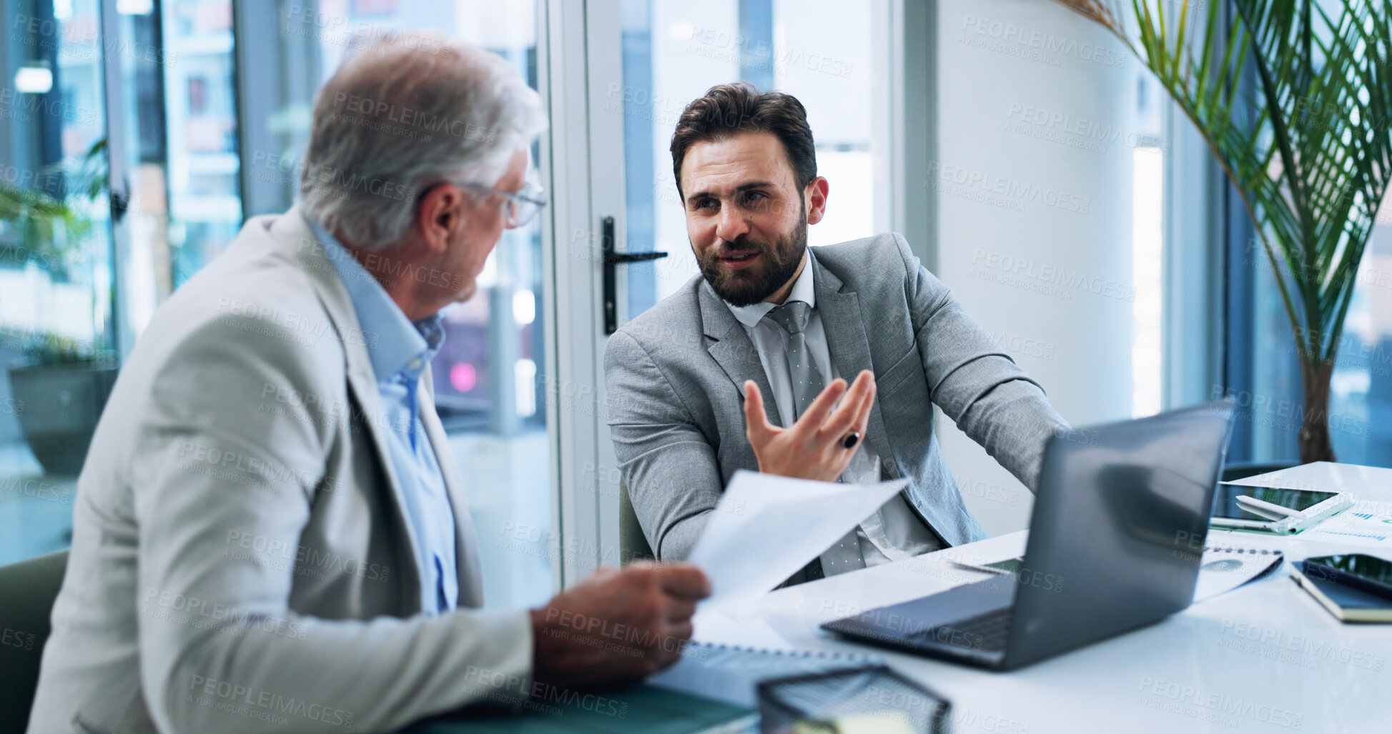 Buy stock photo Business men, strategy and team discussion in office, planning or brainstorming insurance stats with paper. Laptop, meeting and conversation with boss for report, risk management and explain idea