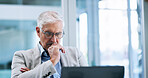 Business, ideas and laptop with mature man in office for corporate administration or problem solving. Planning, solution and thinking with professional employee working on computer for management
