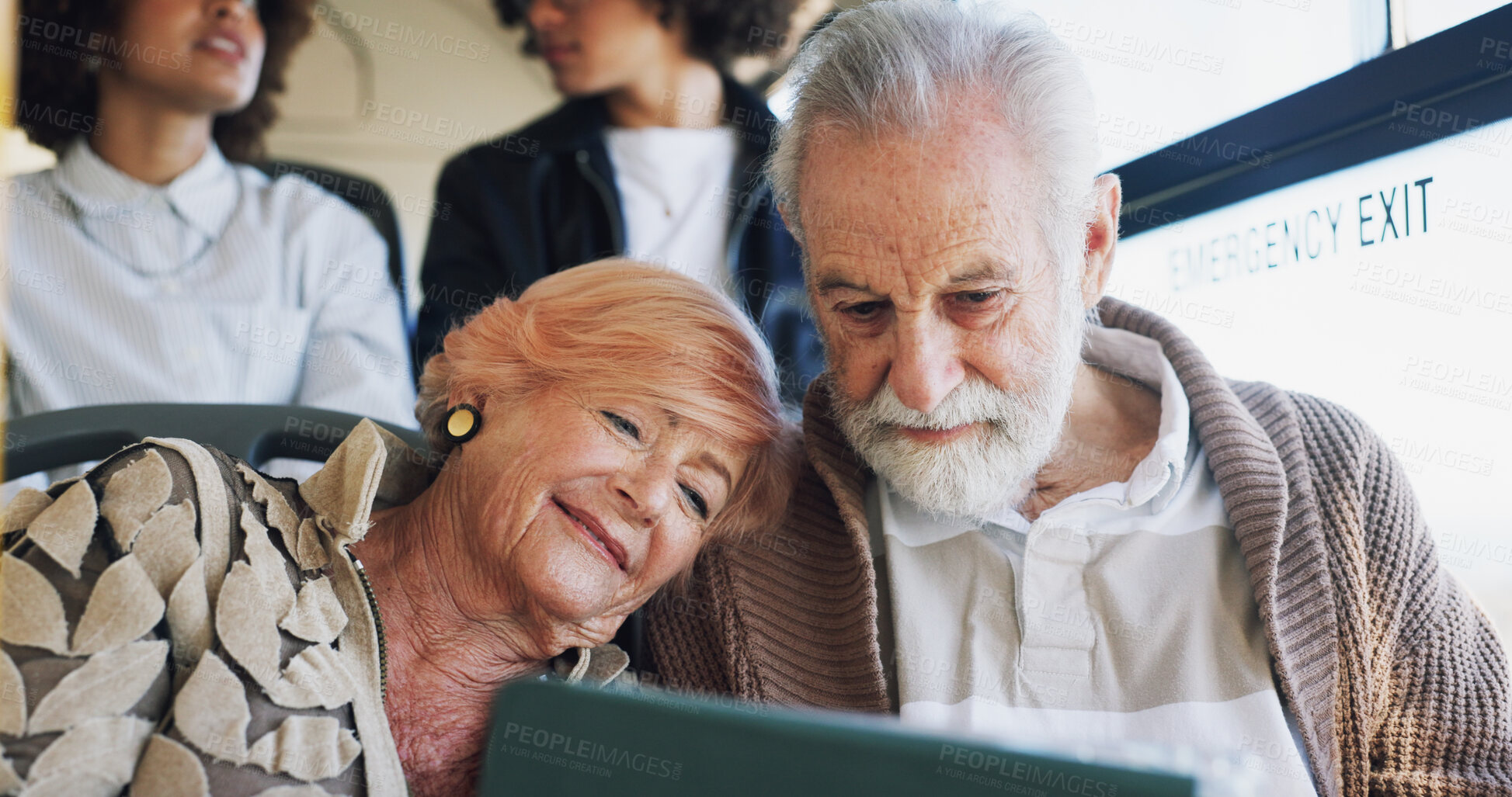 Buy stock photo Senior couple, movies or tablet on bus ride to destination for romantic videos, holiday or vacation. Love, relationship or elderly tourists by window in city transport for retirement or streaming
