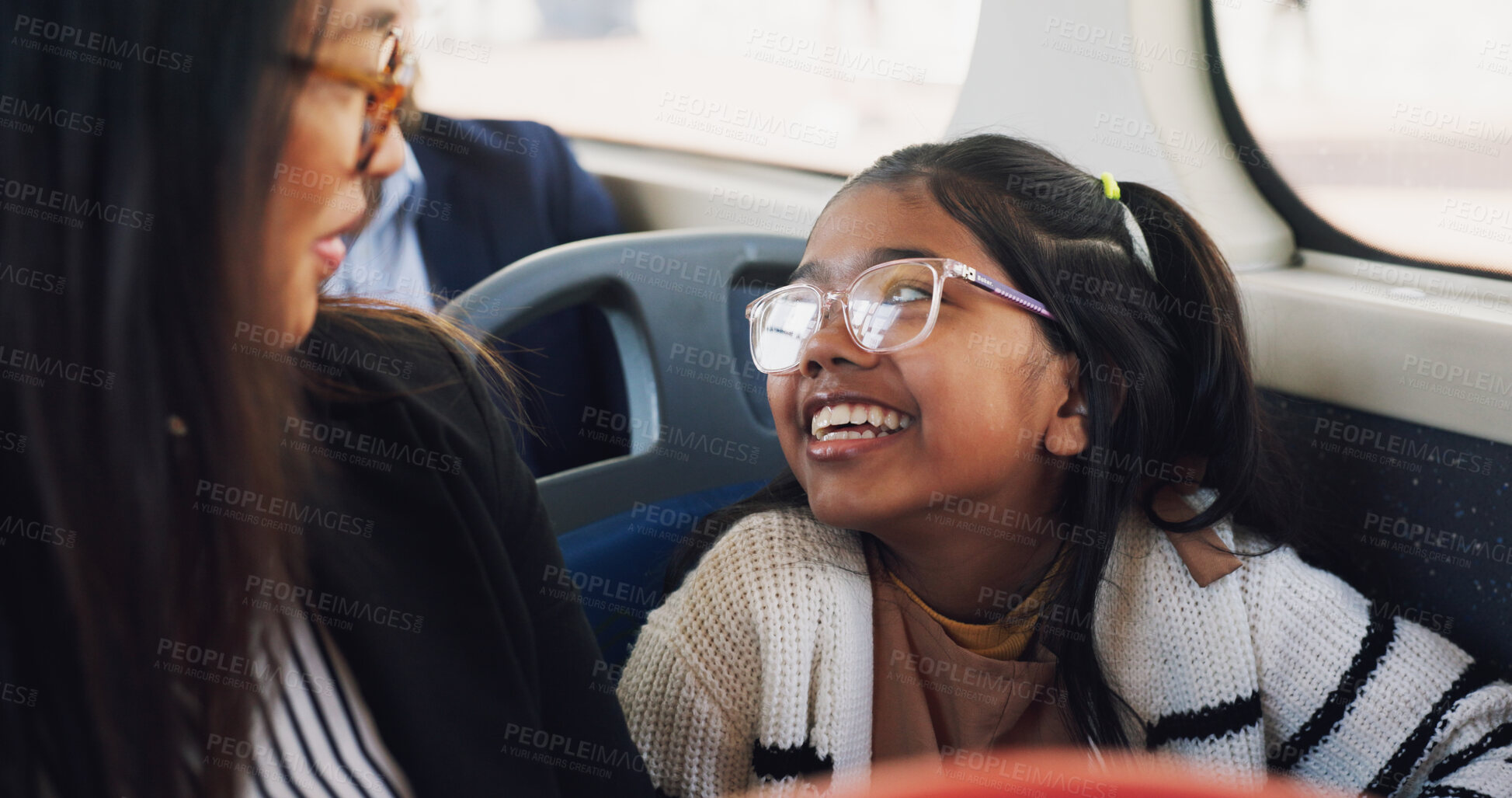 Buy stock photo Journey, mom and daughter in bus, talking and commuting in morning, travel and public transport in city. Happy, woman and child with smile in vehicle, family and bonding with conversation on trip 