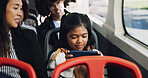 Girl, child and play with phone on bus for entertainment, online streaming or watching in vehicle with mom. Kid, traveler and smile with smartphone in public transport for movie subscription app