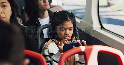 Buy stock photo Girl, child and phone with games on bus for download, entertainment or streaming in morning. Travel, city or female kid playing on mobile smartphone in public transport for online app or subscription