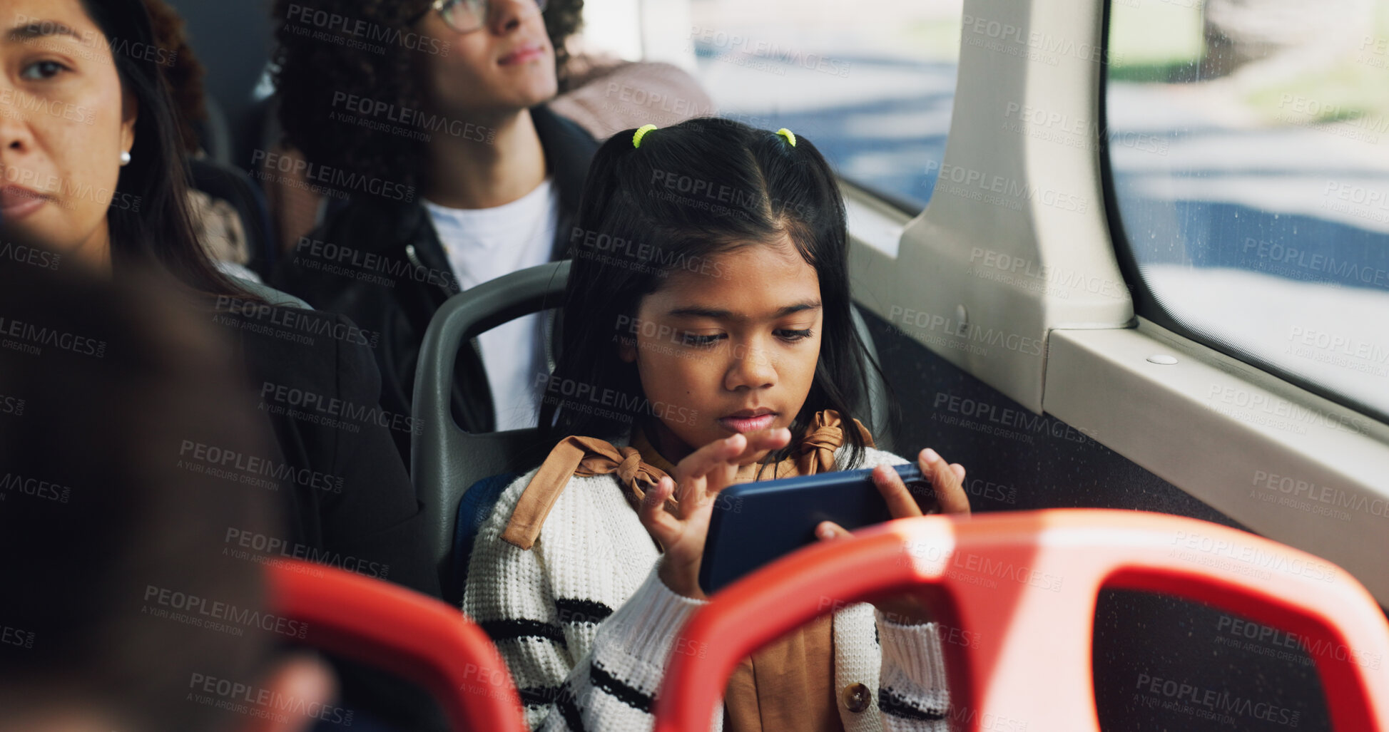 Buy stock photo Girl, child and phone with games on bus for download, entertainment or streaming in morning. Travel, city or female kid playing on mobile smartphone in public transport for online app or subscription