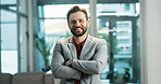 Businessman, portrait and fashion with confidence at office for corporate startup or development. Man, employee or smile with arms crossed in suit for career, job or business attire at workplace