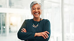 Arms crossed, business and mature woman laughing in office for investment, venture capital or funny. Professional boss, portrait or happy executive with confidence for private equity with experience