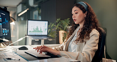 Buy stock photo Woman, typing and computer with trading, graphs and review for revenue report in office at company. Person, keyboard and statistics at night, charts and research with info for stock market at agency