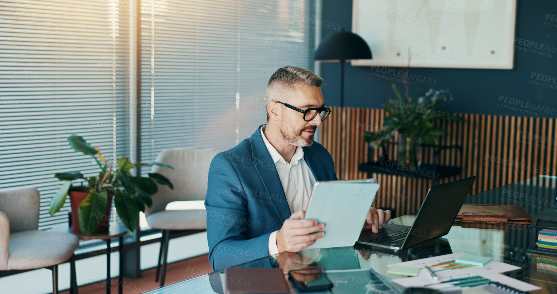 Buy stock photo Tablet, laptop and reading with business man in office for stock broker, account manager or budget report. Market monitor, trade risk and profit growth with mature person for investment planning