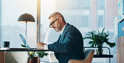 Buy stock photo Business, man and writing on document in office for notes, budget planning and schedule update. Mature person, laptop and paperwork for reminder, information and audit checklist for financial report