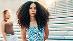 Portrait, fashion and serious woman in city with streetwear, edgy clothes or aesthetic. Cool, female person or swag outdoor with trendy sunglasses, urban outfit or confident with gen z style by steps