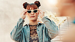 Confident, fashion and woman in city with sunglasses, edgy clothes or aesthetic with trendy streetwear. Cool, female person and outdoor with shades, urban outfit and bold with gen z style by steps
