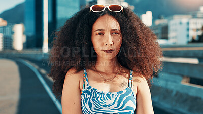 Buy stock photo City, woman and edgy in portrait for fashion, casual clothes and confidence for summer on bridge. Urban, female person and gen z with serious attitude for trendy outfit, stylish and cool look on road