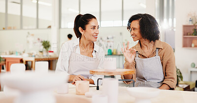 Buy stock photo Pottery, okay sign and women with clay in workshop for teaching, learning and good job. Creative, studio and people with emoji with ceramic mold for design, sculpture and DIY hobby in art lesson