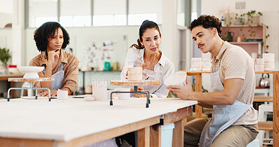 Buy stock photo Pottery class, learning and people in workshop, conversation and technique with sculpture mold. Business owner, artist and ceramic retail store with help, texture or clay manufacturing with advice
