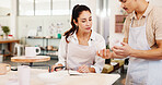 Pottery class, question and instructor in ceramic workshop with help, explain and clay product. Advice, man and woman in studio with support, feedback and sculpture design mold in small business