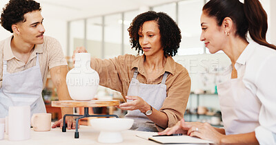 Buy stock photo Pottery, art class and people with vase in workshop for teaching, learning and skills with clay. Creative, studio and man and woman with ceramic mold for design, sculpture and DIY hobby in lesson