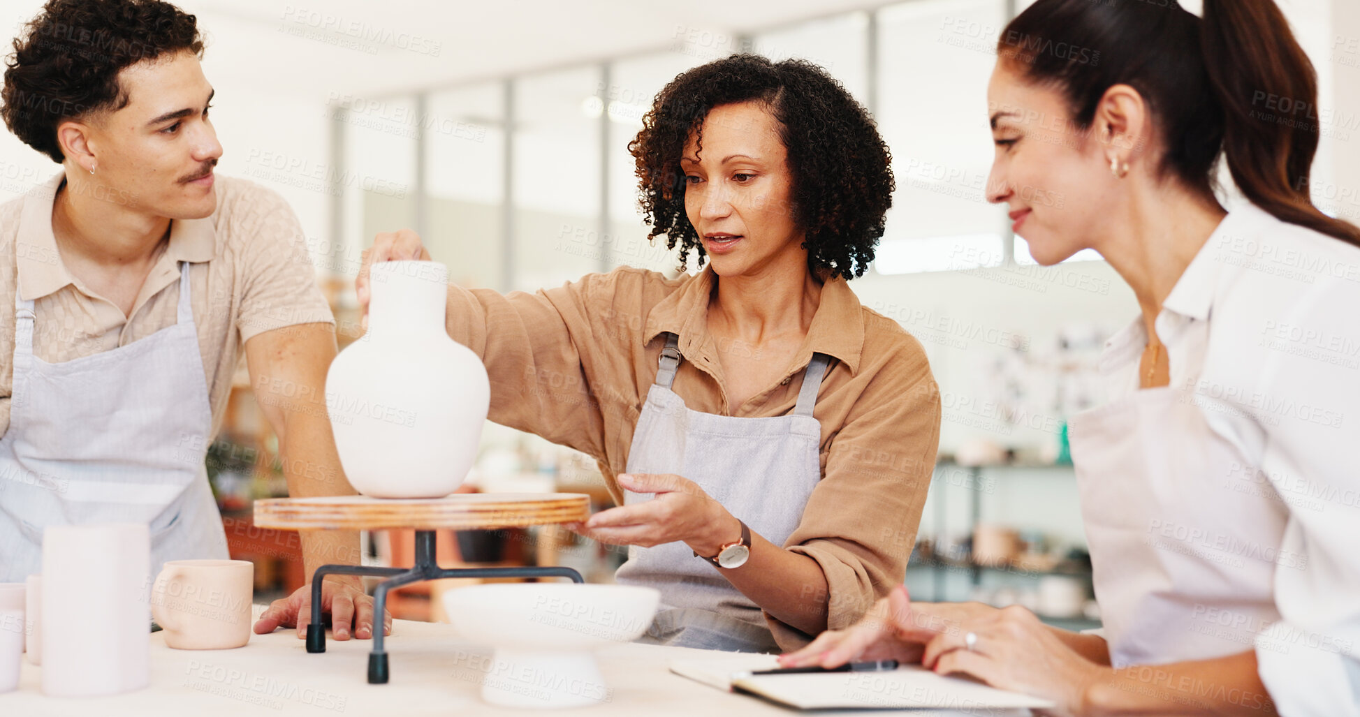 Buy stock photo Pottery, art class and people with vase in workshop for teaching, learning and skills with clay. Creative, studio and man and woman with ceramic mold for design, sculpture and DIY hobby in lesson