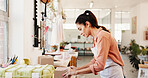 Packing, package and box with woman for small business, ceramics and product with shipping inspection. Sale, pottery and startup with order, shopping and customer parcel for supplier and shipment
