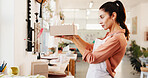 Small business, package and box with woman for order, ceramics and product with shipping inspection. Sale, pottery and startup with packing, shopping and customer parcel for supplier and shipment
