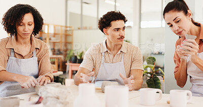 Buy stock photo Pottery class, group and people in workshop, technique and learning with sculpture mold. Business owner, artist and ceramic retail store with texture, talking or clay manufacturing with art product