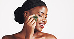 Cosmetics, skincare and black woman with gua sha in studio for lymphatic drainage, natural beauty or self care. Dermatology, girl and smile with jade stone for radiant skin on white background mockup