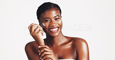 Buy stock photo Portrait, skincare and woman with cream, studio and moisturizing of face with lotion, hydration and smile. White background, happy and black person with cosmetics for treatment, glow and smooth skin