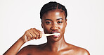 Toothbrush, dental hygiene and portrait of black woman in studio for wellness, brushing teeth and cleaning. Space, whitening and face of person for oral care, health and grooming on white background