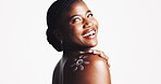 Happy, black woman and shoulder with sunscreen for skincare in studio on a white background. Female person, model or smile with satisfaction for moisturizer, SPF protection or lotion on mockup space
