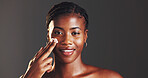 Portrait, beauty and woman with cream, skincare and smile for smooth skin with routine and moisturizing. Gray background, hydration and black person with lotion for treatment, studio and grooming