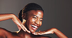 Black woman, hands and face in studio for skincare in portrait, excited or results by background. African person, girl and smile for change with beauty, glow or cosmetics with mockup space in Nigeria