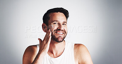 Buy stock photo Apply, portrait and happy man with face cream for skincare space, moisturiser or collagen. Smile, wrinkle treatment or male person on white background in studio for cosmetics, beauty or facial lotion