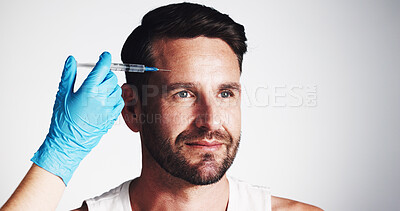 Buy stock photo Forehead, needle and beauty with man in studio for filler injection, anti aging and aesthetic treatment. Collagen benefits, wrinkles and cosmetics with mature person and hand on white background