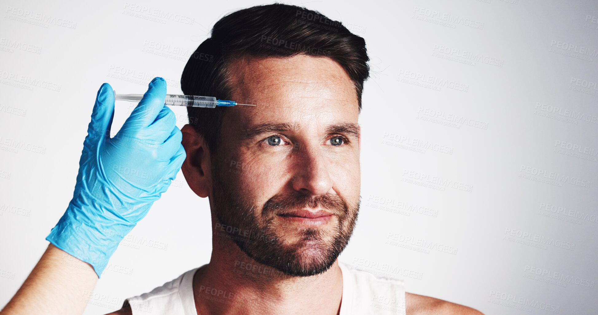 Buy stock photo Forehead, needle and beauty with man in studio for filler injection, anti aging and aesthetic treatment. Collagen benefits, wrinkles and cosmetics with mature person and hand on white background