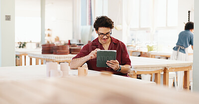 Buy stock photo Man, tablet and happy at pottery workshop with update for web store with sculpture, tea cup and typing at studio. Person, digital touchscreen and manager with app for ceramic product with inventory