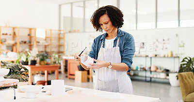 Buy stock photo Workshop, woman and inspection with cup for pottery, small business and notes for stock management. Ceramic store, female person and potter with checklist for writing, order and mug as product