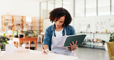 Buy stock photo Pottery, writing and woman with tablet in workshop for inventory management, stock supply and online order. Small business, potter or digital checklist for account invoice or sales tracking in studio
