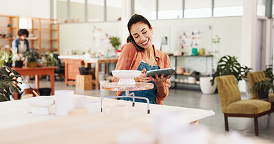 Buy stock photo Phone call, pottery and woman in workshop with tablet for inventory, schedule and order clay supply. Ceramic art, happy person and technology for conversation, client follow up and creative craft