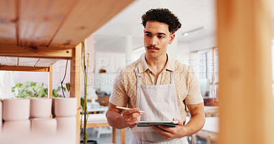 Buy stock photo Ceramic, pottery and man with tablet in workshop for inventory management, stock inspection or quality control. Small business, potter and digital checklist for product supply, art pricing or invoice