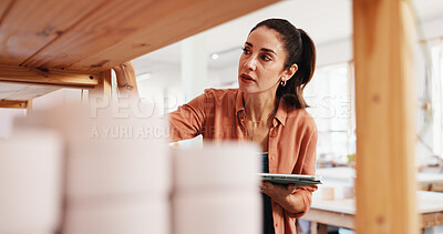 Buy stock photo Pottery shelf, tablet and woman in workshop for inventory, inspection and checklist of ceramic designs. Creative business, art studio and person on digital tech for DIY hobby, planning and website