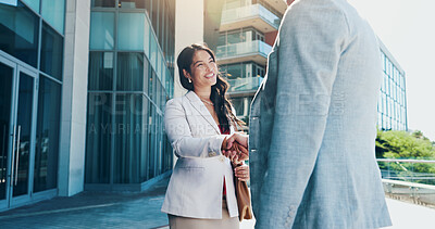 Buy stock photo Business people, meeting and city with handshake for partnership, B2B or corporate deal. Employees, colleagues or shaking hands with smile for greeting, introduction or agreement in an urban town