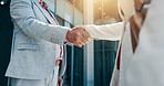 Business people, city and corporate deal with handshake for partnership, b2b or agreement. Closeup, employees or colleagues shaking hands with lens flare for greeting or introduction in an urban town