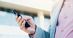 Business, hands and man in city, cellphone and texting with social media, internet and search for location. Person, closeup and entrepreneur with smartphone, outdoor or app for ride service and email