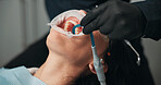 Hands, medical procedure and mouth of patient with dentist in office for checkup or surgery. Dental hygiene, filling or healthcare with medicine professional and woman at clinic for oral exam