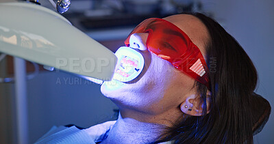 Buy stock photo Appointment, mouth and ultraviolet with patient at dentist for checkup, operation or surgery. Dental hygiene, light or teeth whitening with woman at clinic for dentistry, oral healthcare or procedure