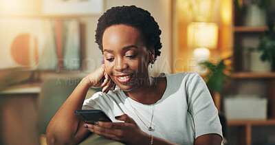 Buy stock photo Black woman, happy and relax with phone in home for social media scroll, reading online news and ebook. Night, person and internet connection on sofa for dating site browse, blog post and research