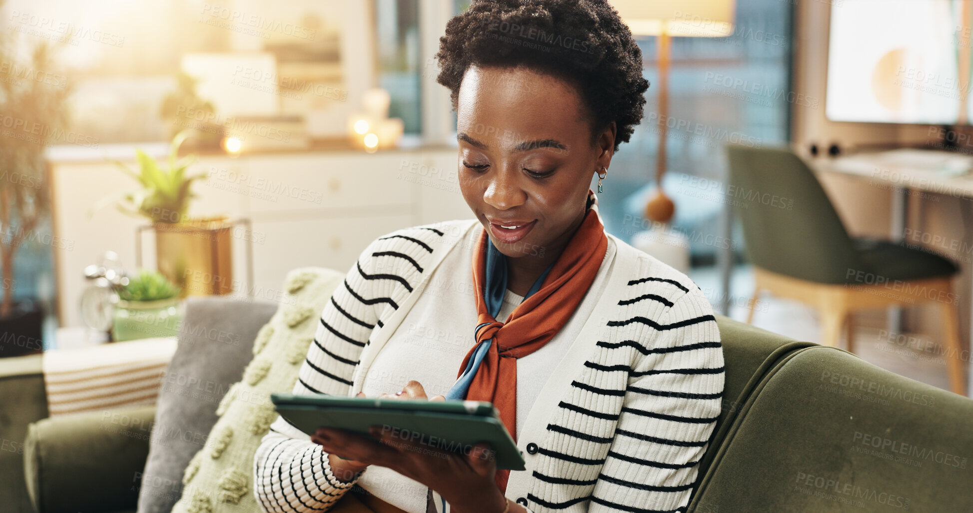 Buy stock photo Online, tablet and black woman in home for remote work, blog and ghost writer check report. Sofa, freelancer and technology with happy author reading email, research story and editing publication
