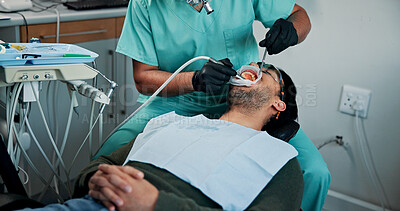 Buy stock photo Man, patient and dentist cleaning mouth with tools for bacteria or germ removal at orthodontist. Male person, client or teeth surgeon with suction for tooth extraction, dental or oral care at clinic