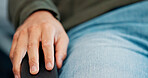 Waiting room, therapy and hands of person on chair for consultation, session and appointment. Psychology, healthcare and closeup of man in clinic for wellness, counselling and meeting for support