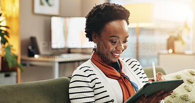Buy stock photo Pen, tablet and black woman in home for remote work, blog or ghostwriter writing article. Sofa, freelancer and technology with happy author reading email, research story or editing publication online